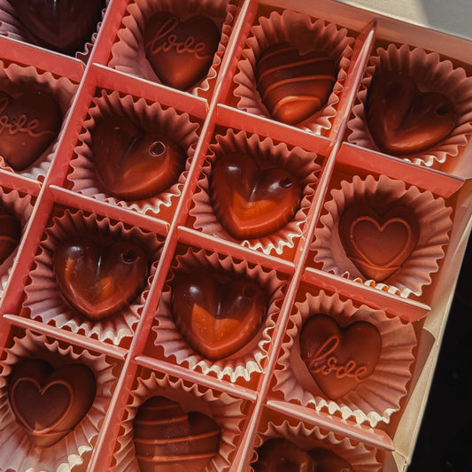 Pink gift box containing chocolate-shaped coffee-scented wax melts